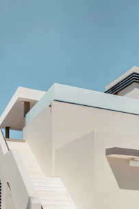 white concrete building under blue sky during daytime