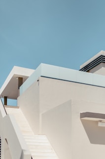 white concrete building under blue sky during daytime