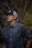 man in blue dress shirt and blue fitted cap