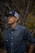 man in blue dress shirt and blue fitted cap