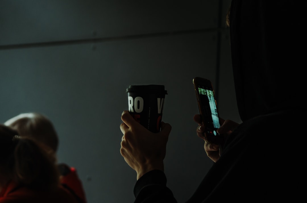 person holding black and silver smartphone