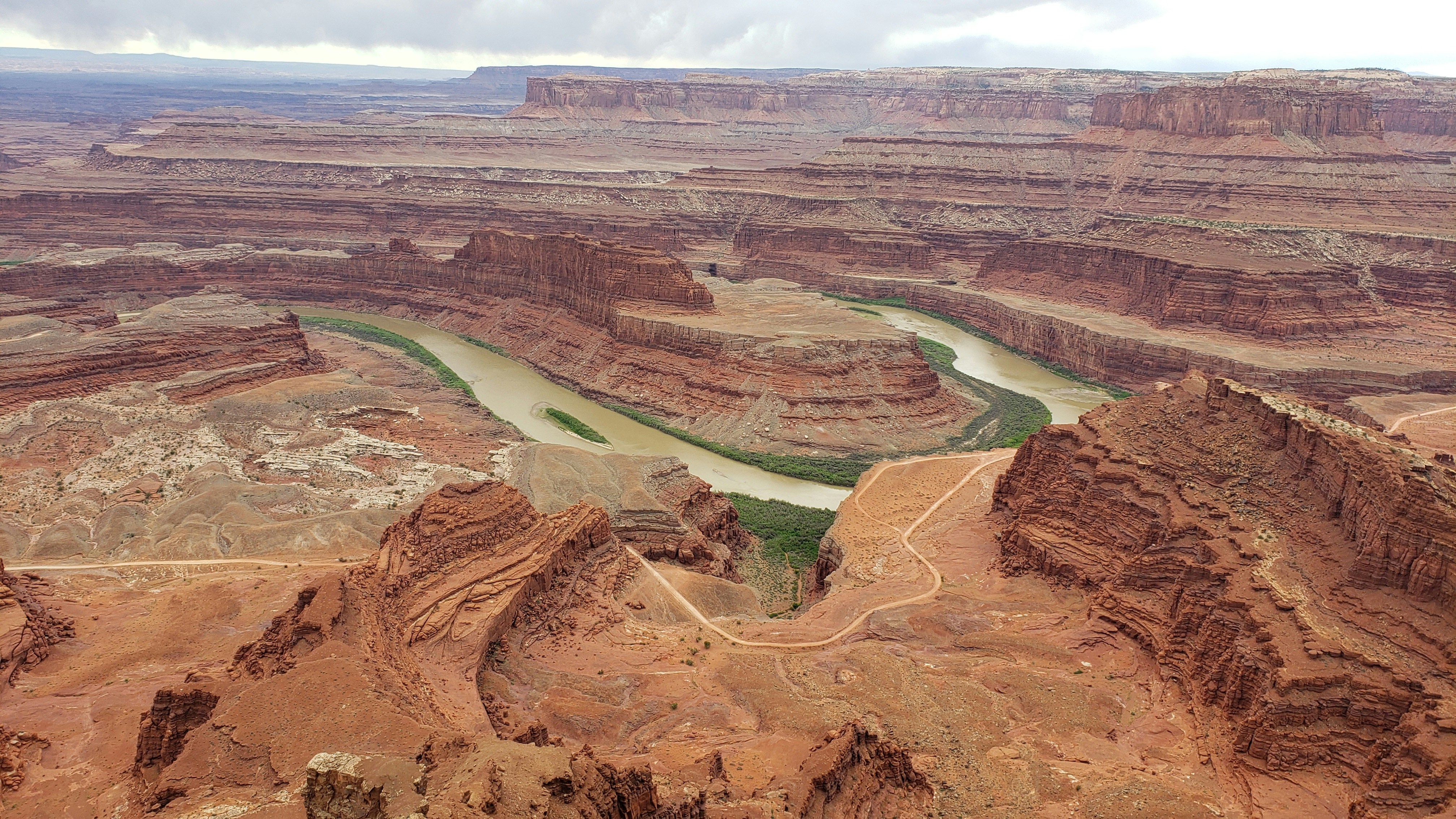 aerial view of brown and green field during daytime, Green River flowing through Canyonlands NP, Utah
