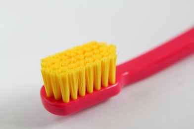 yellow and red plastic straw
