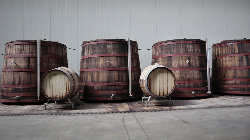 brown wooden barrels on brown wooden floor