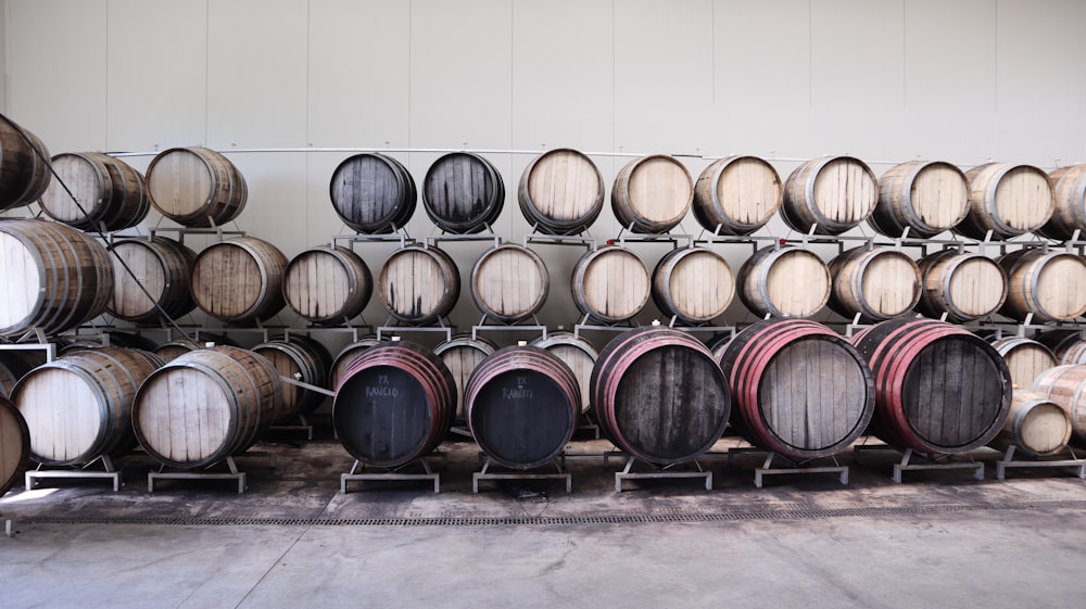 brown wooden barrels on gray concrete floor