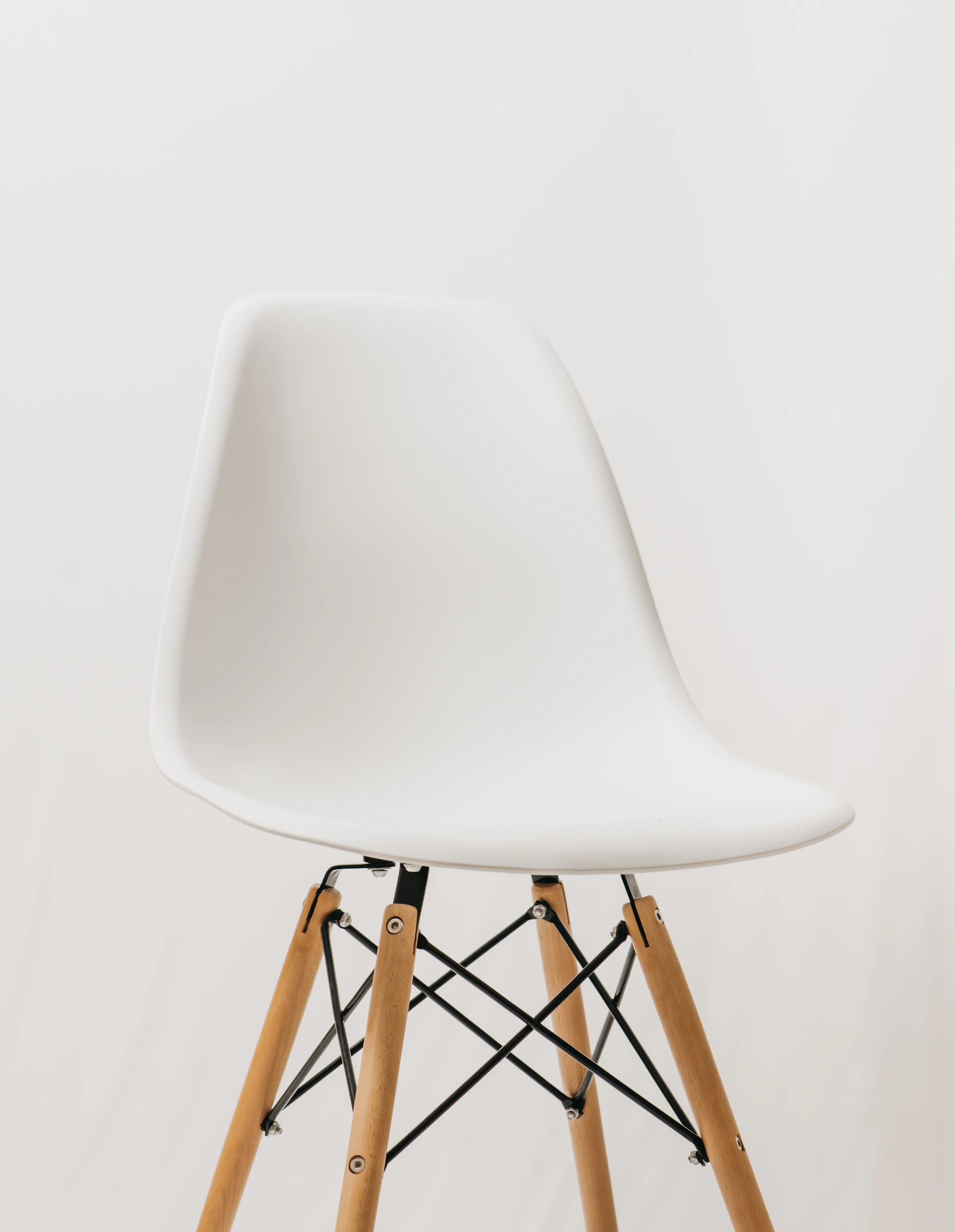 white chair with brown wooden frame