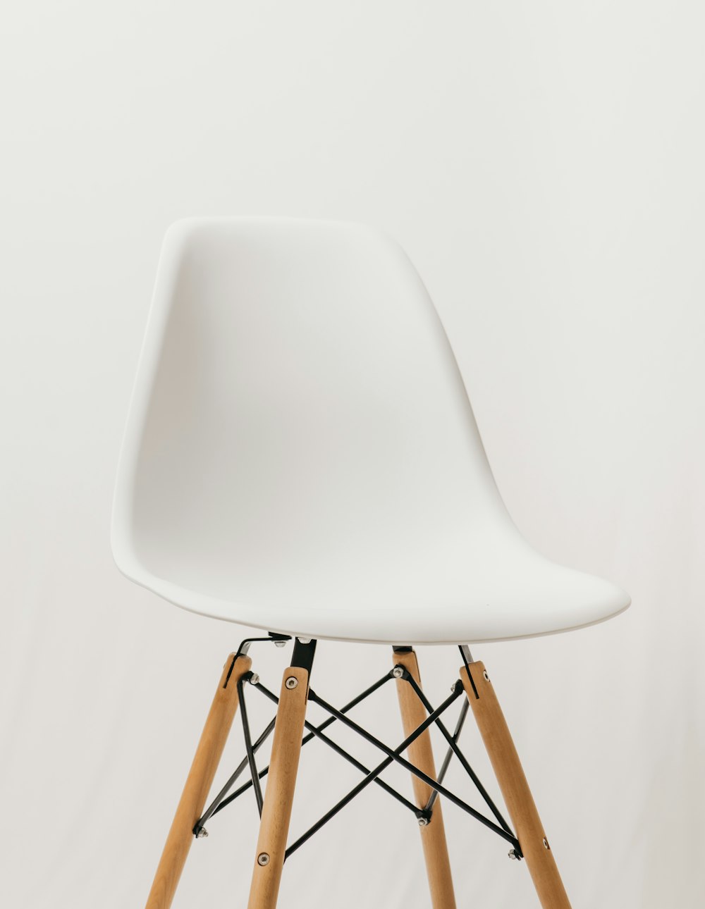 white chair with brown wooden frame