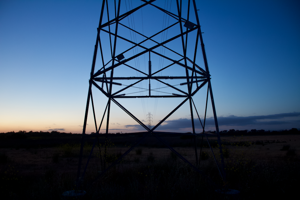 gray metal tower under blue sky during daytime