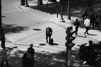 A black and white photo of The Beatles walking across Abbey Road, iconic and timeless.