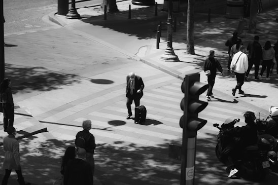 A black and white photo of The Beatles walking across Abbey Road, iconic and timeless.