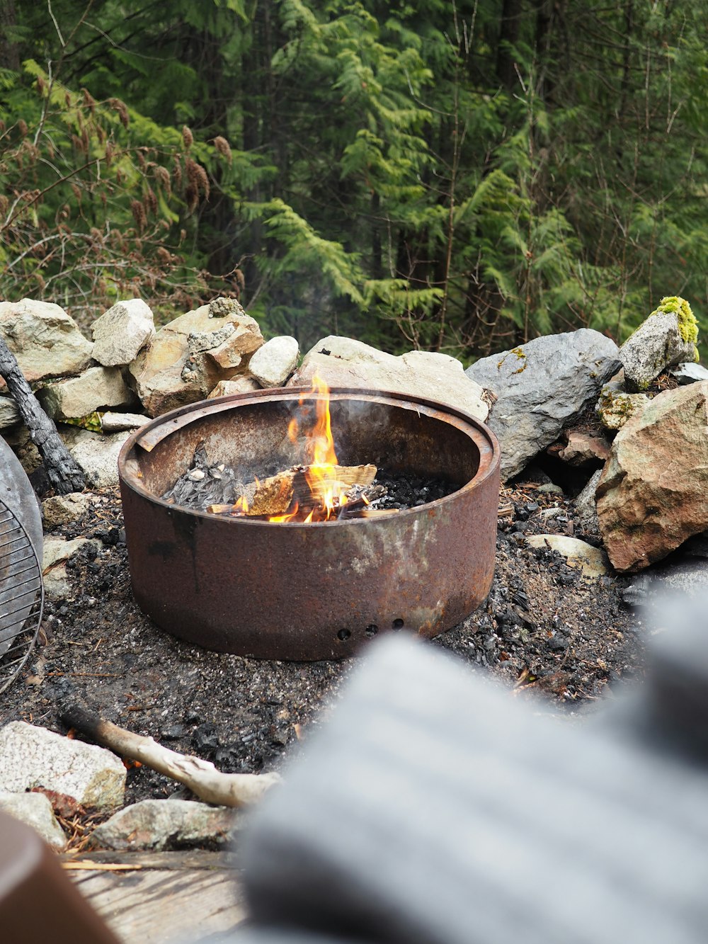 brown fire pit on gray rocks