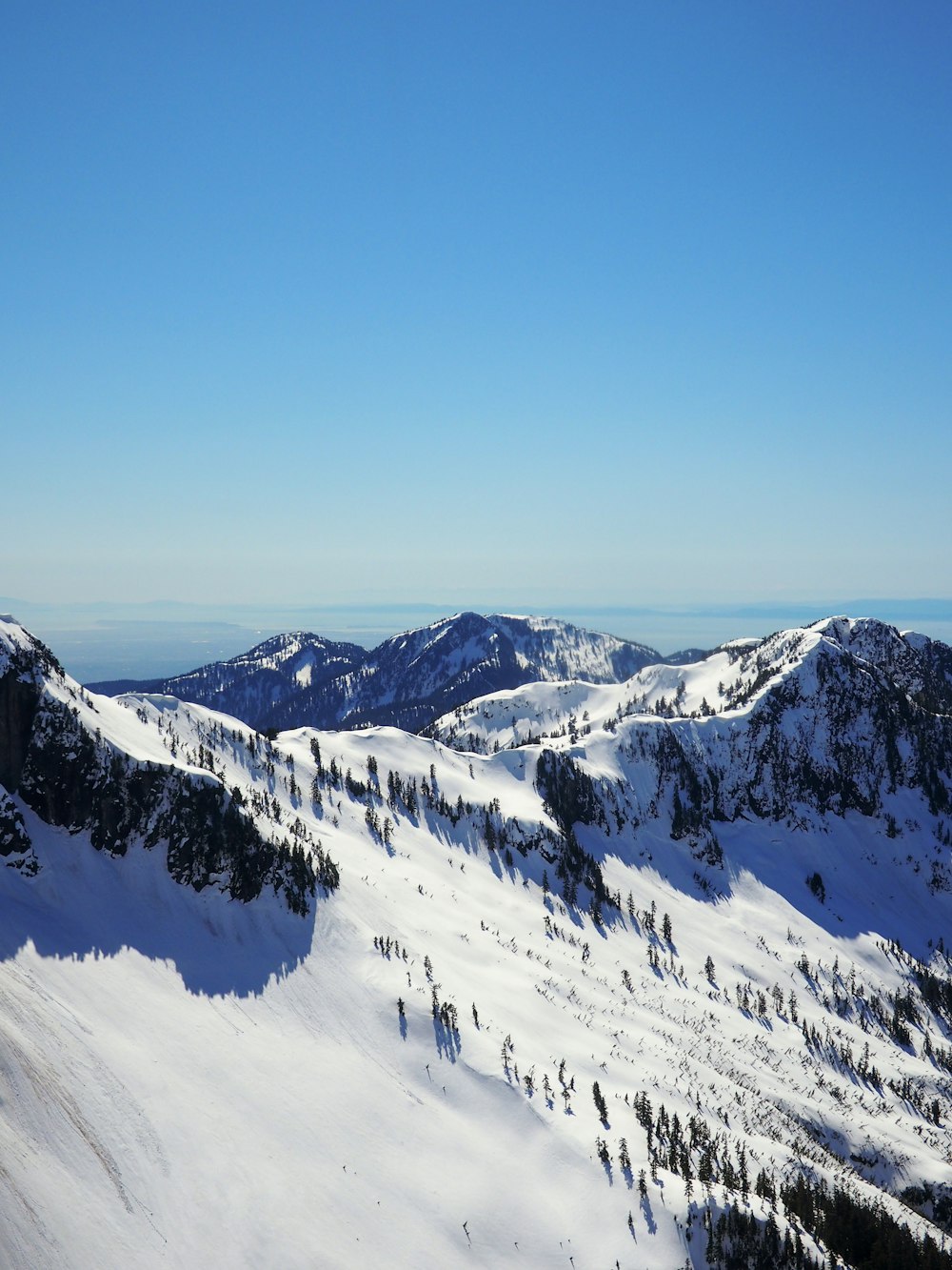 snow covered mountain under blue sky during daytime