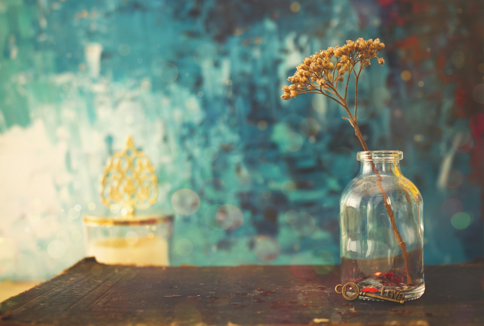 white flowers in clear glass jar
