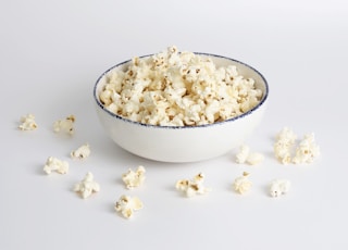 white popcorn in white ceramic bowl