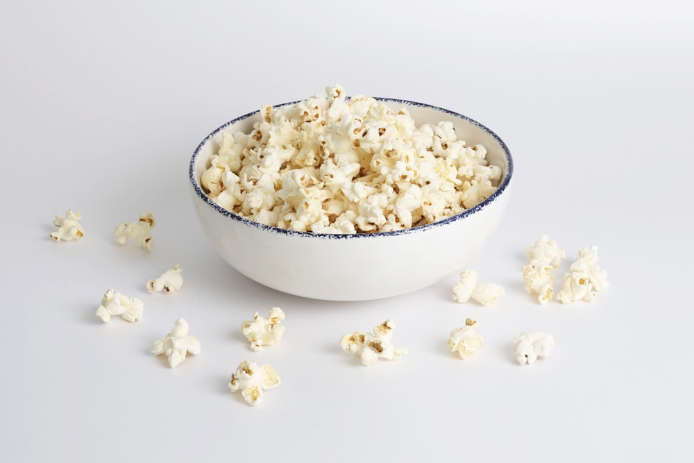 white popcorn in white ceramic bowl