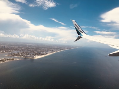 A scenic aerial shot of a coastal city taken during a flight