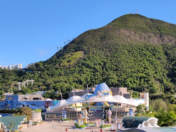 A family happily entering a theme park with tickets in hand.