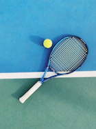 white and blue tennis racket