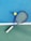 white and blue tennis racket