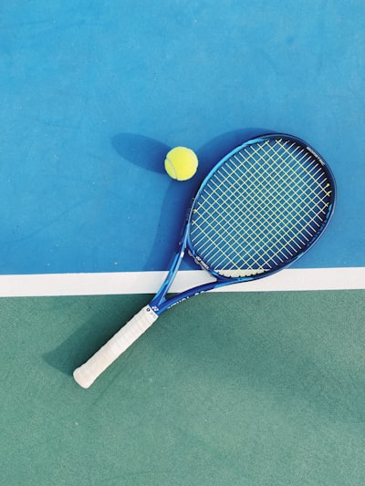 white and blue tennis racket