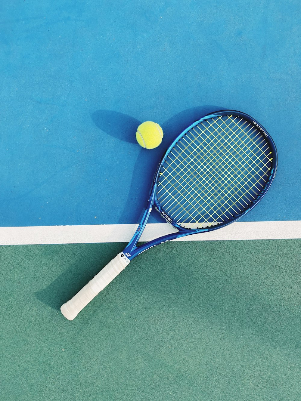 white and blue tennis racket
