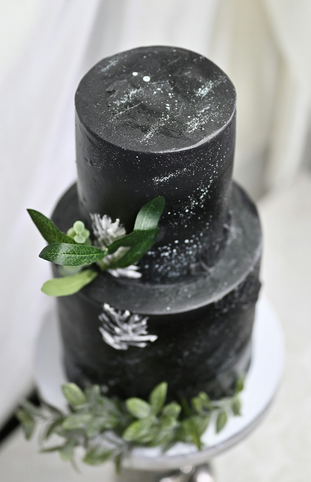 black round cake with green leaf on top