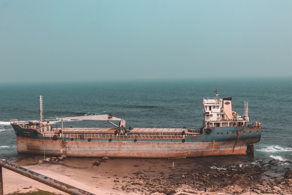 brown ship on sea during daytime