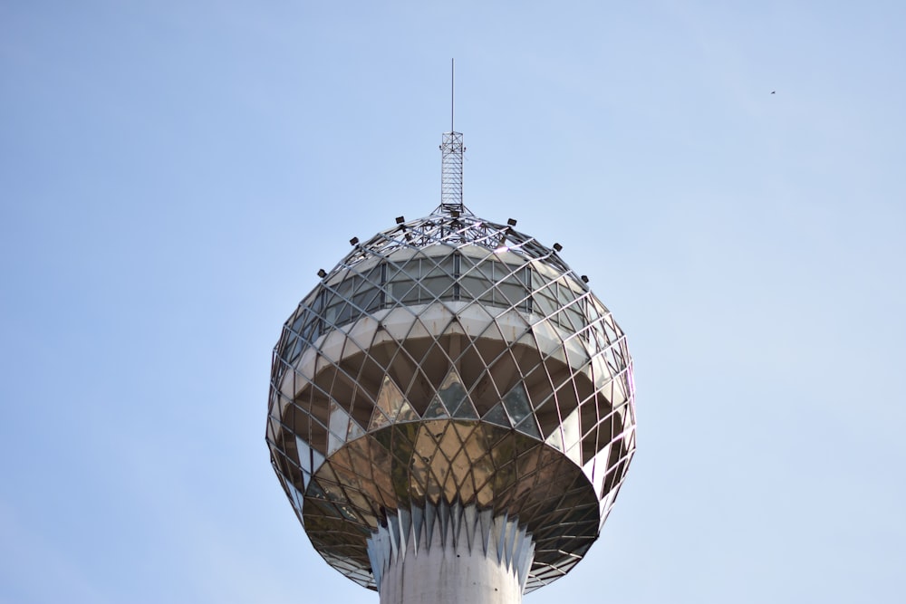 silver round building under blue sky during daytime