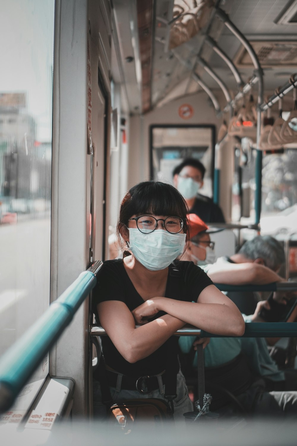 woman in black tank top wearing blue goggles sitting on chair