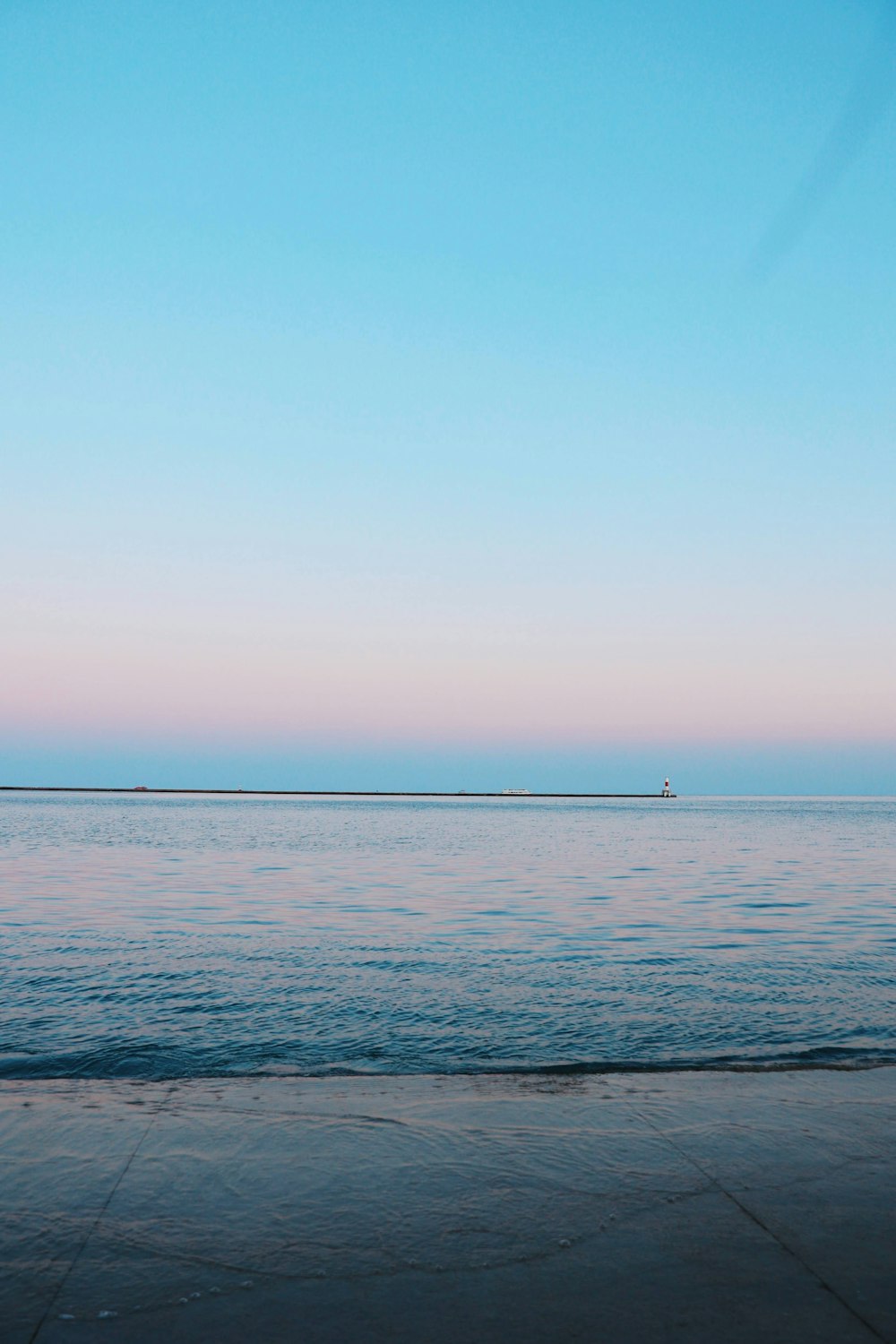 body of water under blue sky during daytime