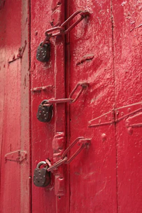 red wooden door with silver padlock