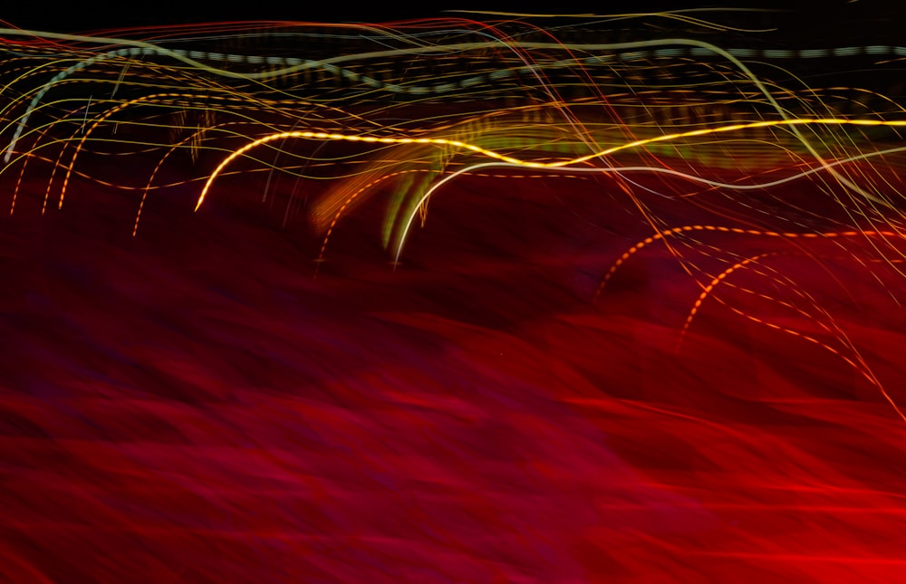 red and yellow lights on black background photo – Free Pattern Image on  Unsplash