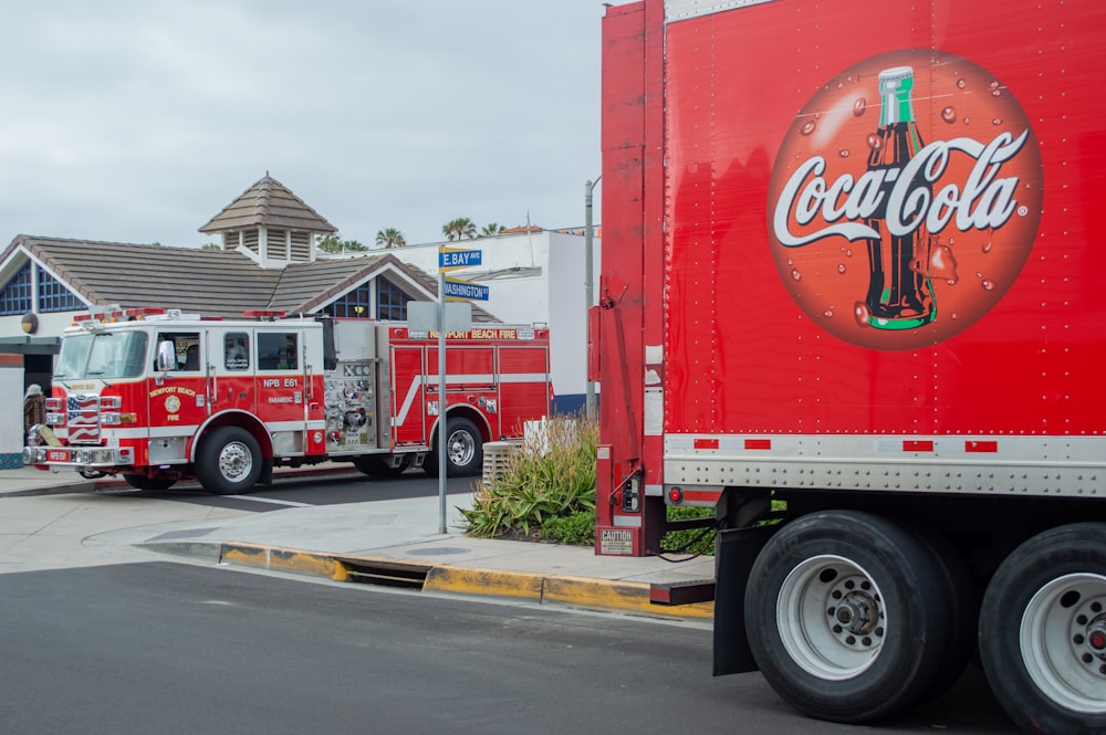 red and white coca cola truck on road during daytime