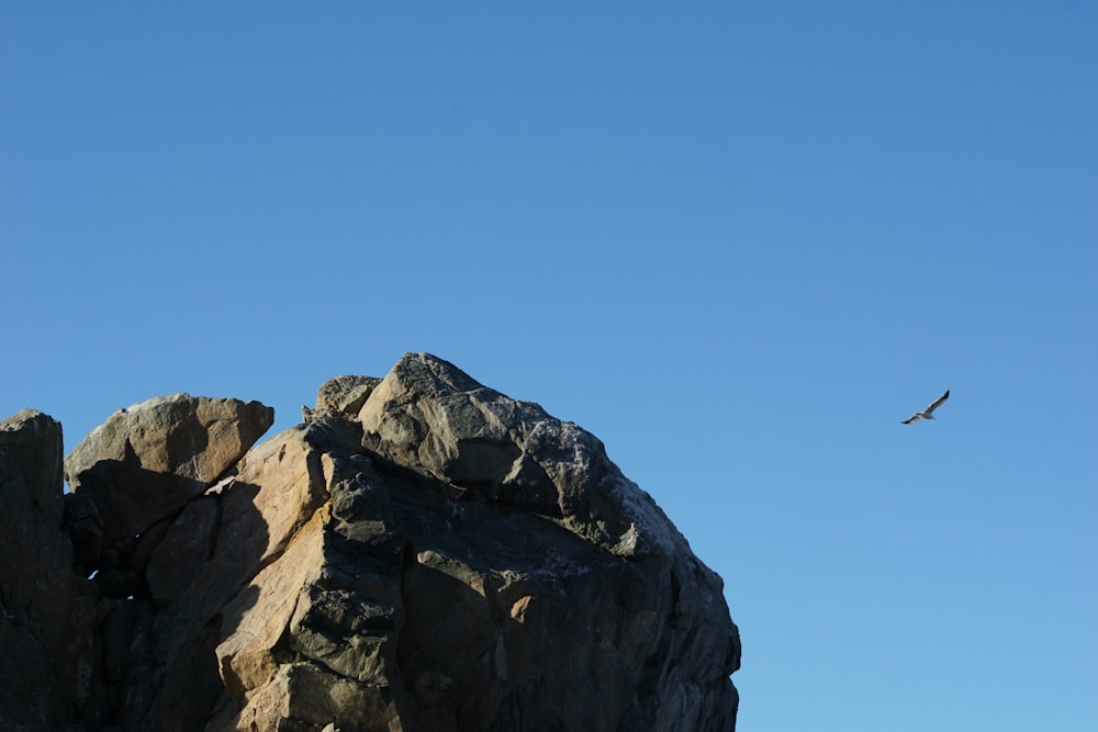 gray rocky mountain under blue sky during daytime