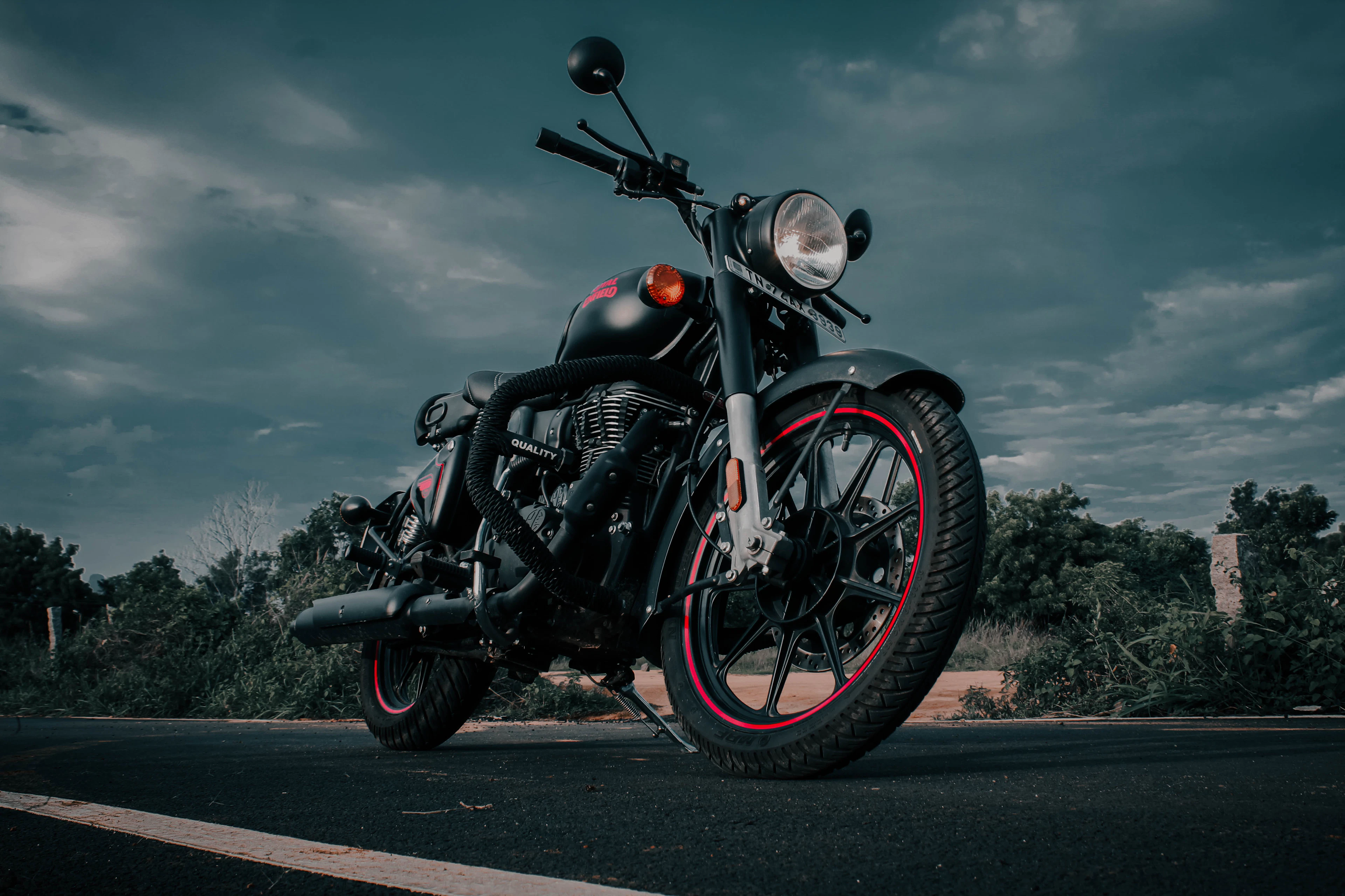 A Royal Enfield motorcycle on a road, seen from the front left