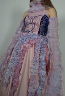 Anarkali gown featuring delicate hand-stitched floral patterns in pastel hues.