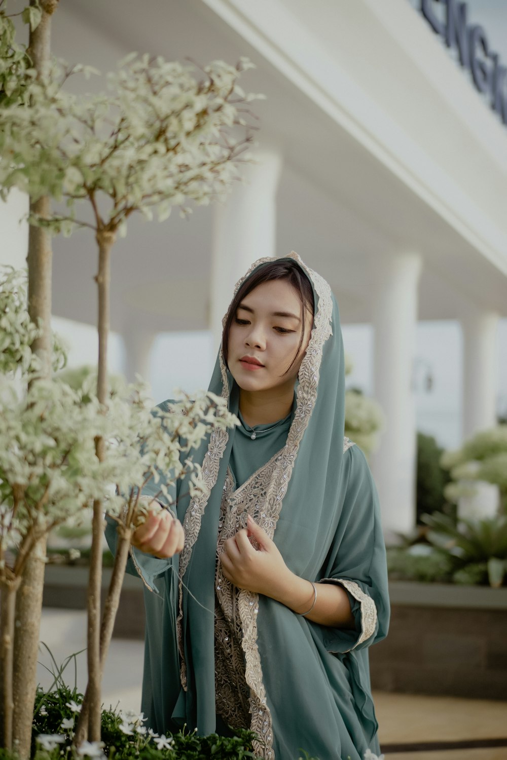 woman in blue dress wearing white hijab