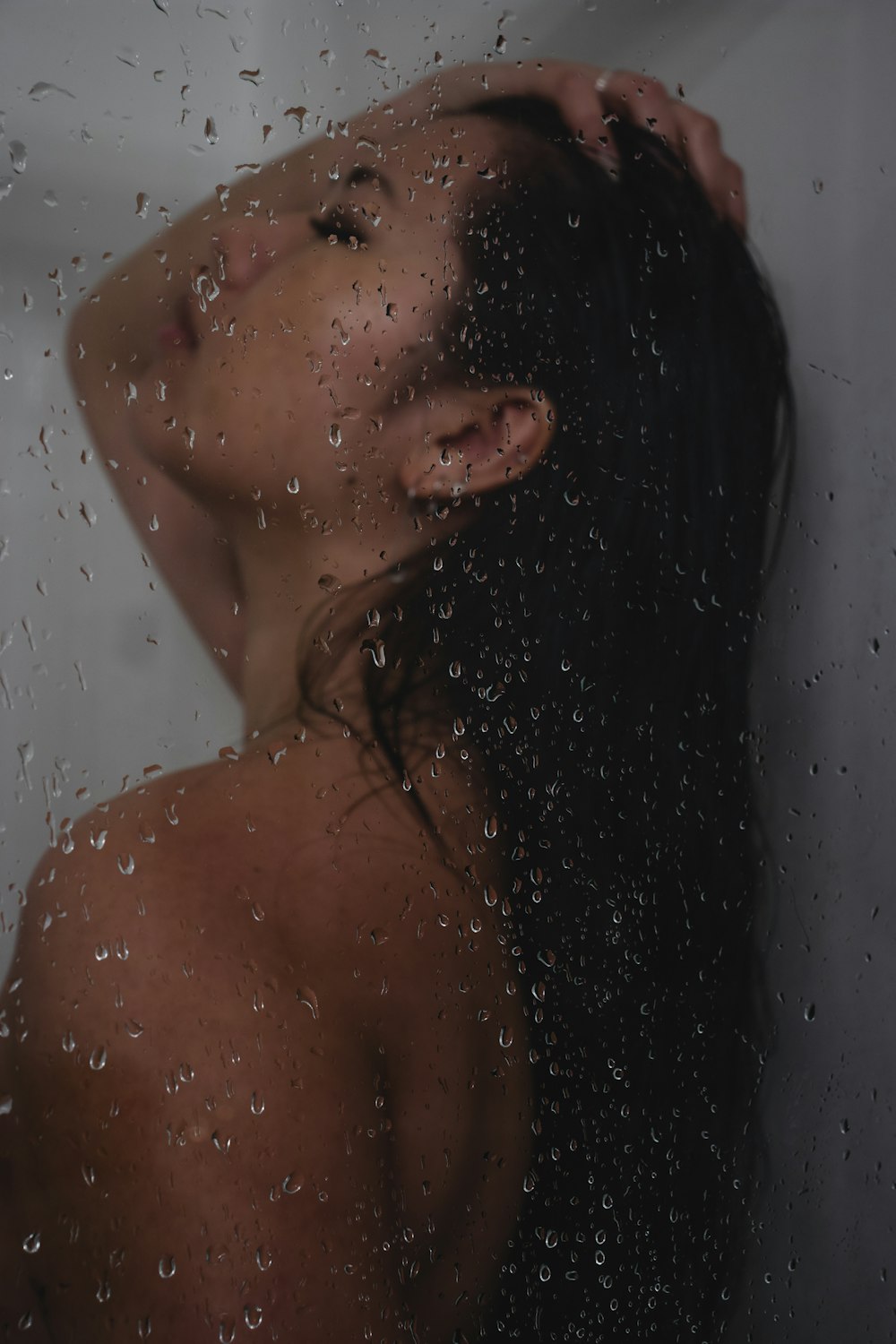 topless woman in white bathtub