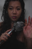 Technician installing a new shower head with care and precision.