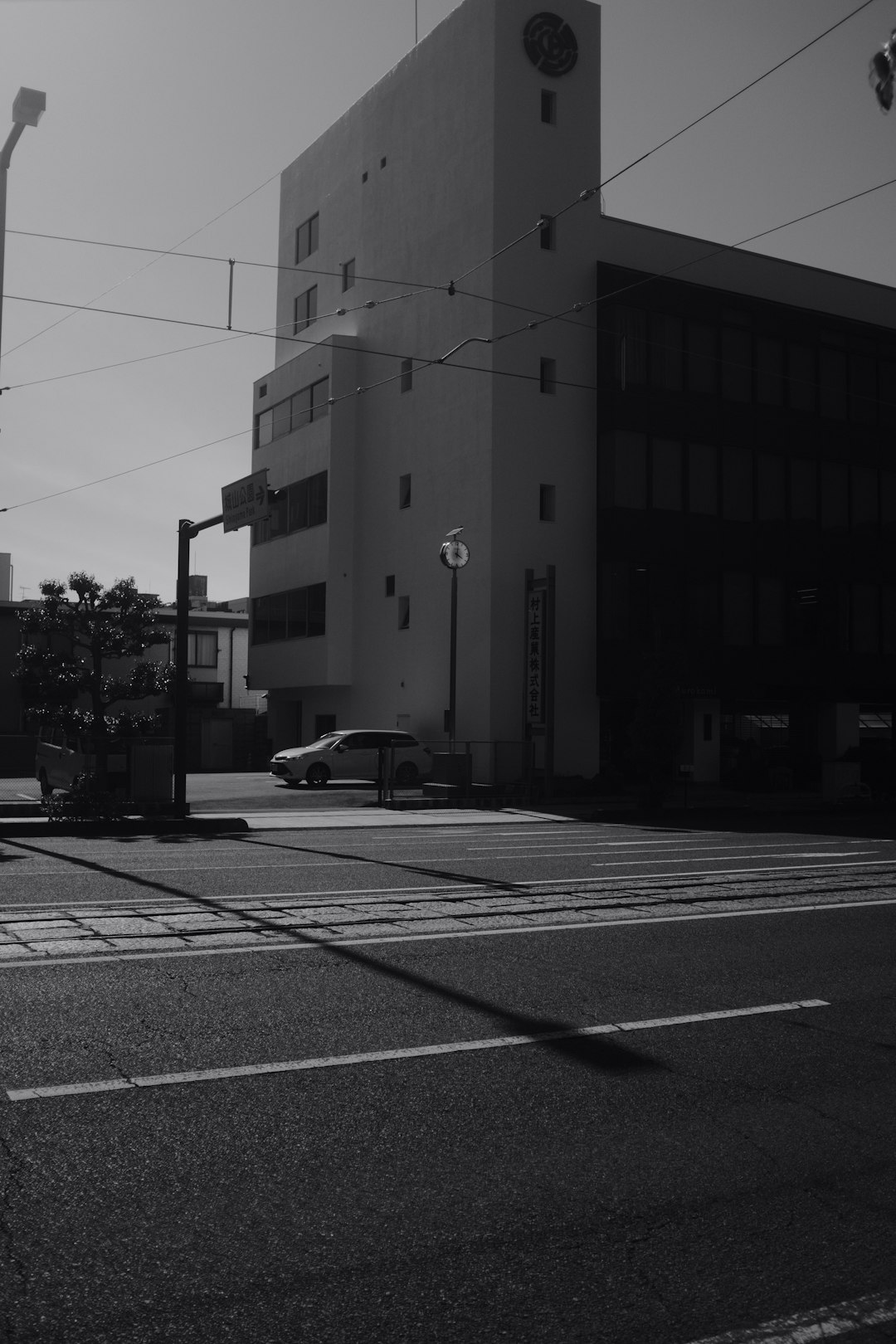 grayscale photo of building near road