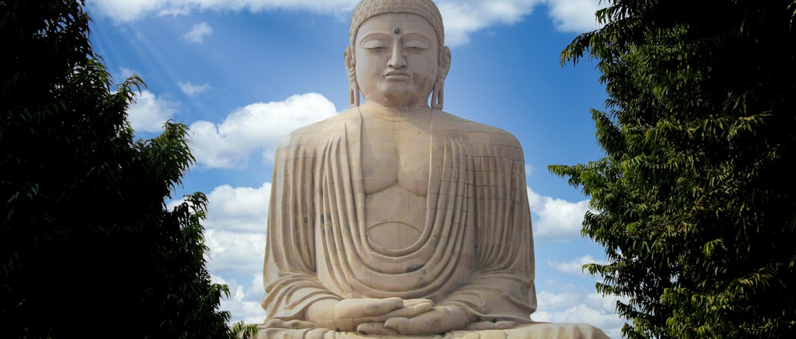 white concrete statue under blue sky during daytime