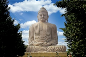 white concrete statue under blue sky during daytime