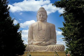 white concrete statue under blue sky during daytime