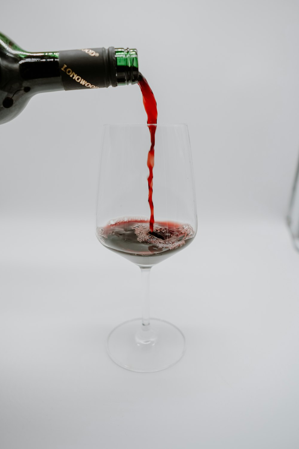 clear wine glass with red wine