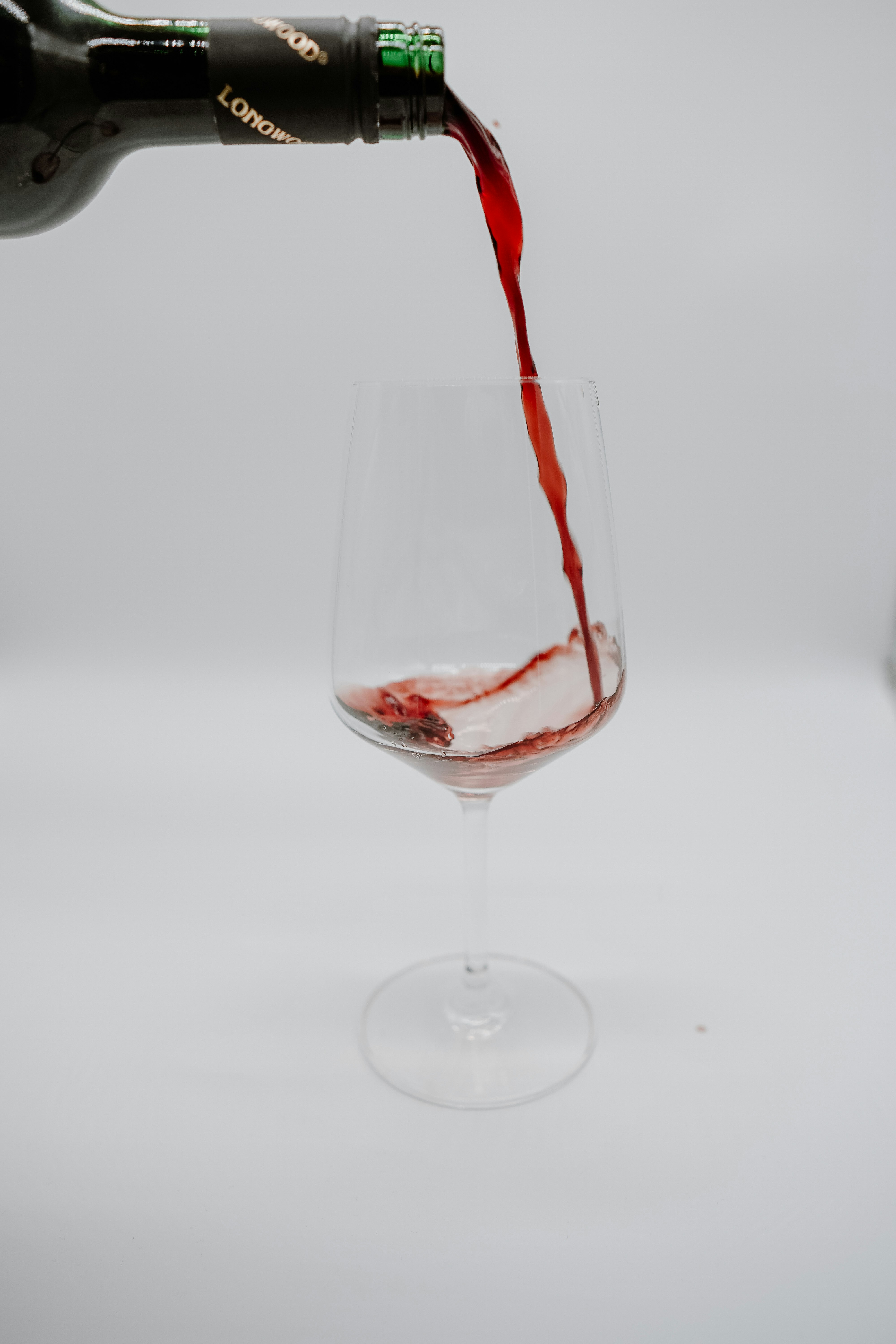 clear wine glass with red wine