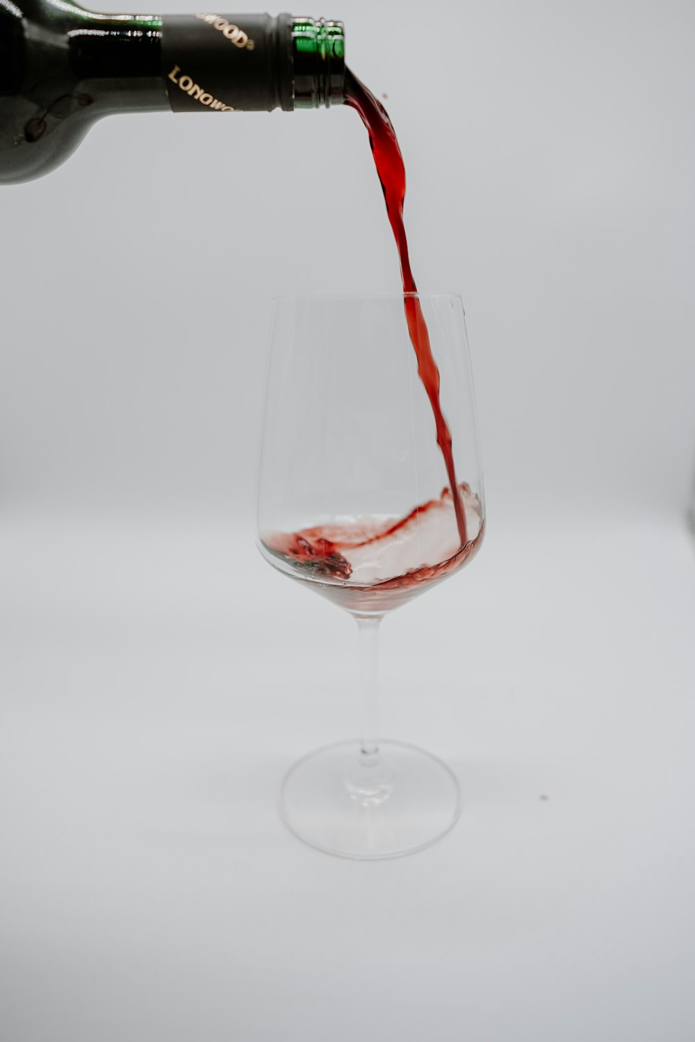 clear wine glass with red wine