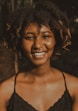 smiling woman in black spaghetti strap top