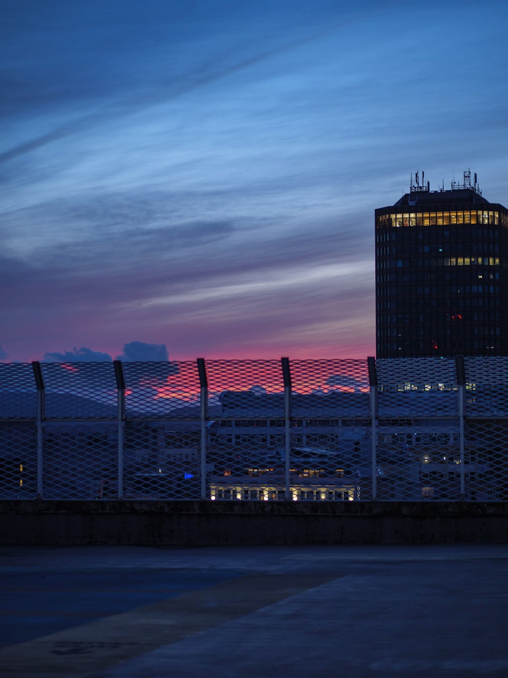 black and red building under cloudy sky during daytime