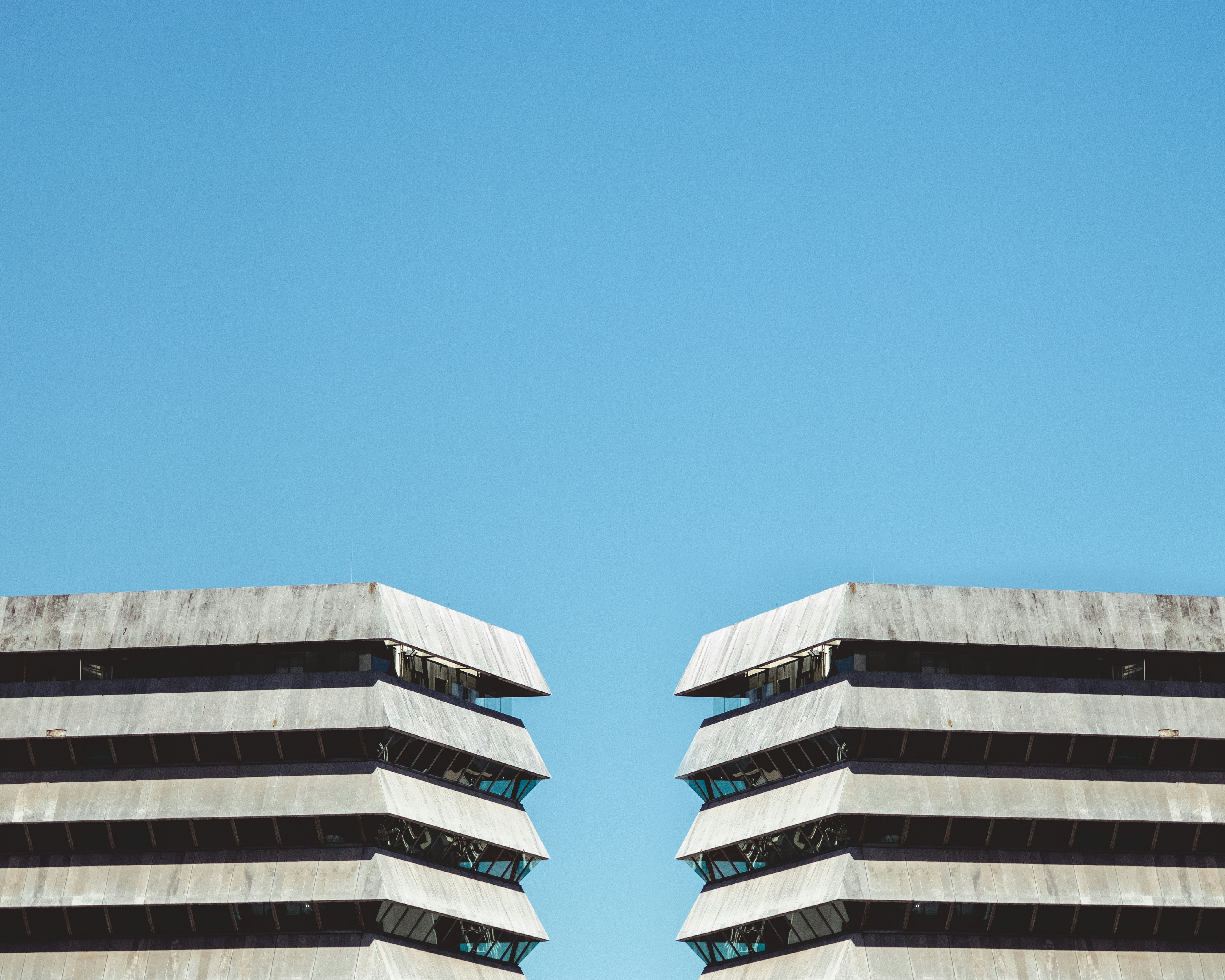 white concrete building under blue sky during daytime