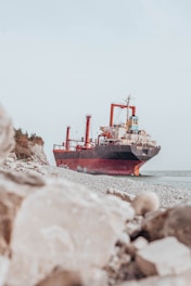 red ship on sea during daytime